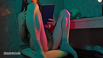 Redhead girl Emmi Evans gets turned on while reading, leading to solo masturbation