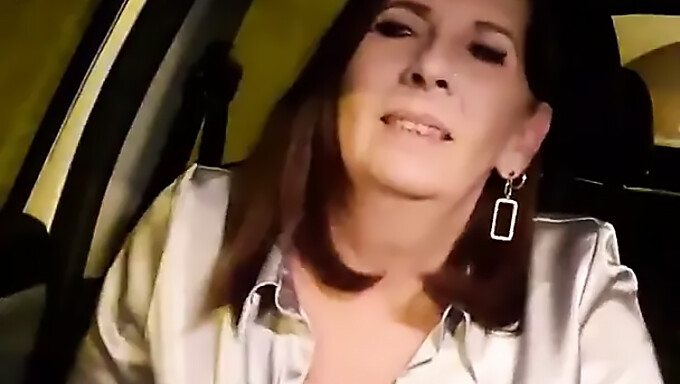 Milf indulges in outdoor masturbation in her car