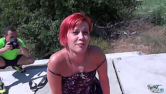 Redheaded beauty takes a big cock in public outdoor setting